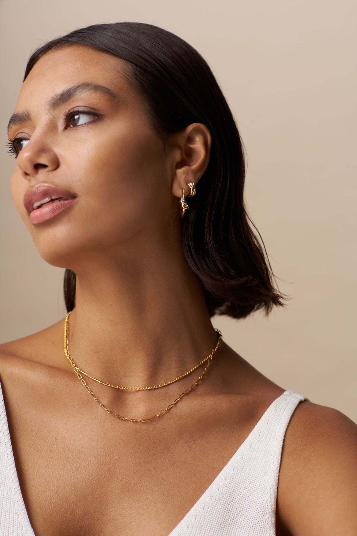 Polished Twist Huggie Hoop - Guld