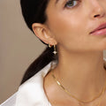 Mini Domed Huggie Hoops - Pale Gold