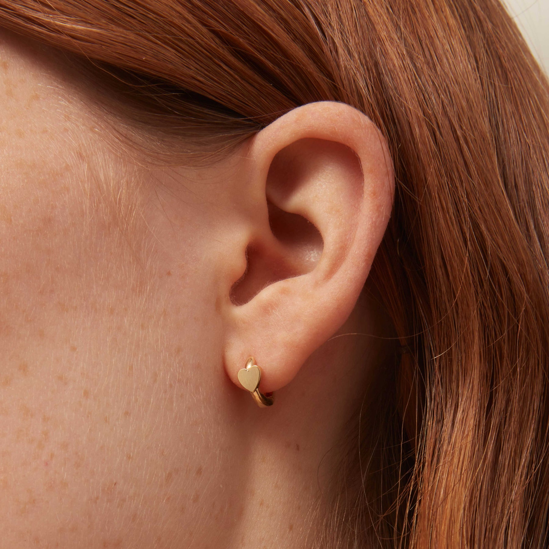 Mini Heart Stationed Huggie Hoops - Pale Gold