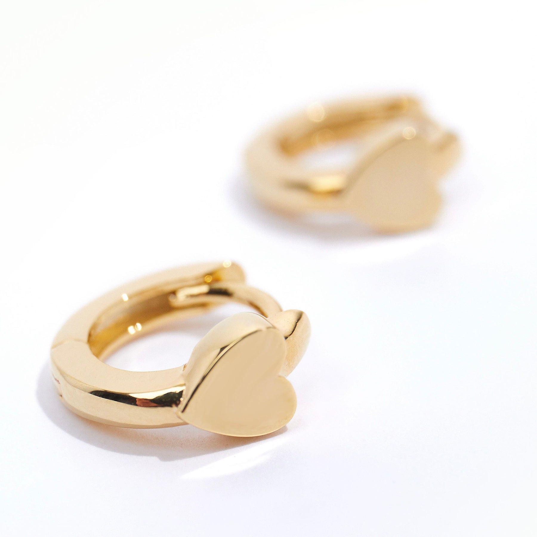 Mini Heart Stationed Huggie Hoops - Pale Gold