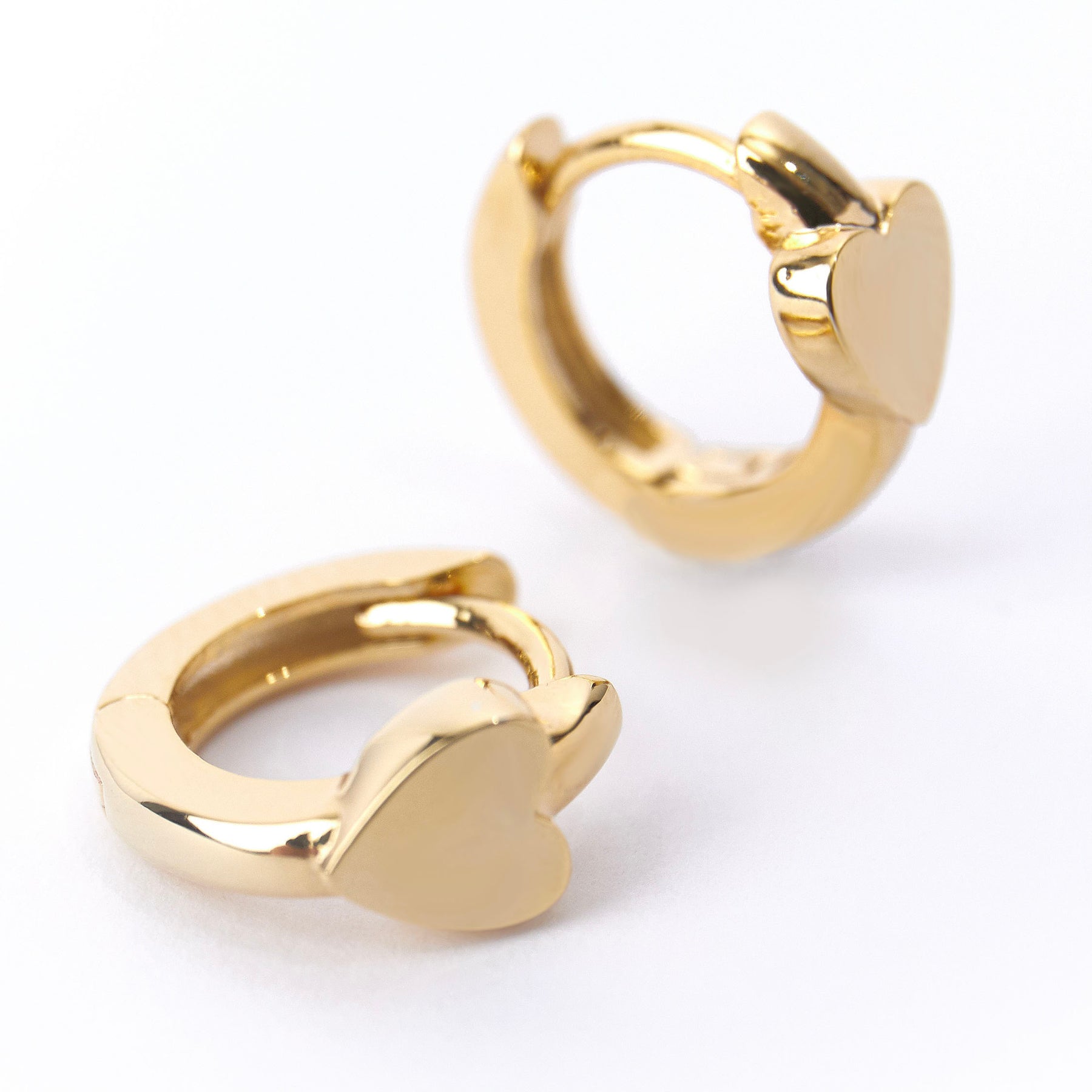Mini Heart Stationed Huggie Hoops - Pale Gold